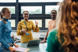 teacher smiling and gesturing
